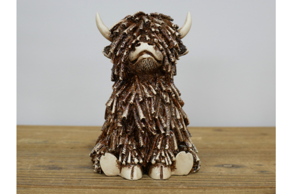 Sitting Highland Cow