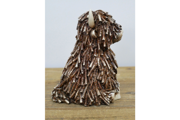 Sitting Highland Cow