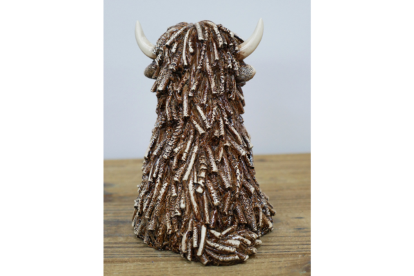 Sitting Highland Cow