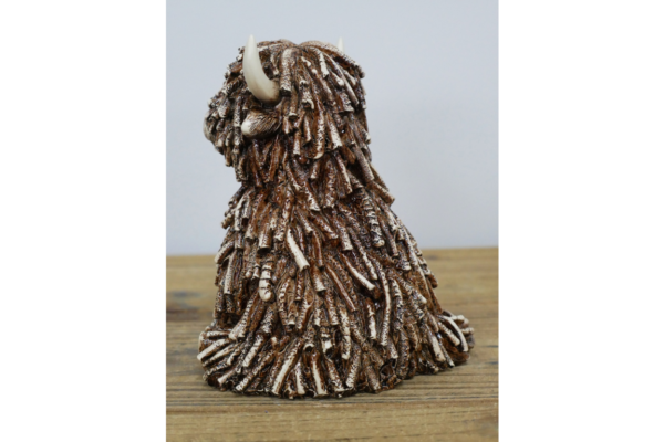 Sitting Highland Cow