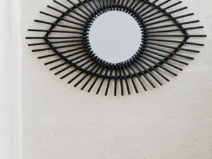 1102183_liv_01.jpg_-_web_size__72872.1768371522.jpg Mataram Black Natural Rattan Eye Shape Wall Mirror